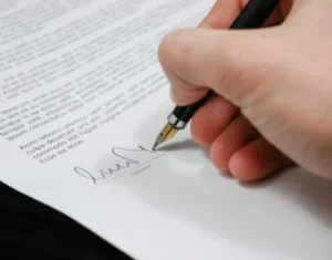 Guest blogger contract being signed